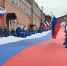 100-метровый флаг России растянули на Ивановском спуске в Нижнем Новгороде - фото 1 - vGorodeN.Ru